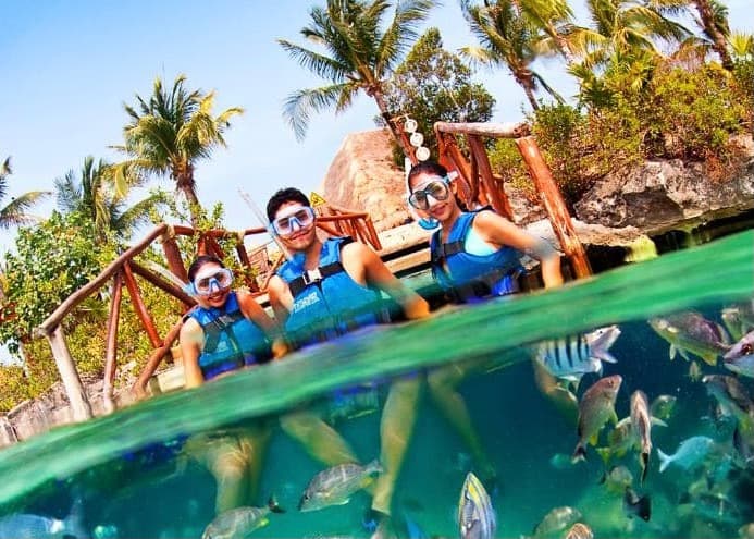 Snorkeler exploring the turquoise waters of Xel-Ha lagoon